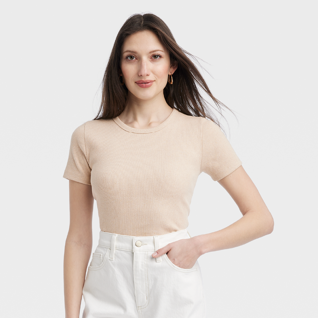 A model wearing a beige Universal Thread t-shirt.