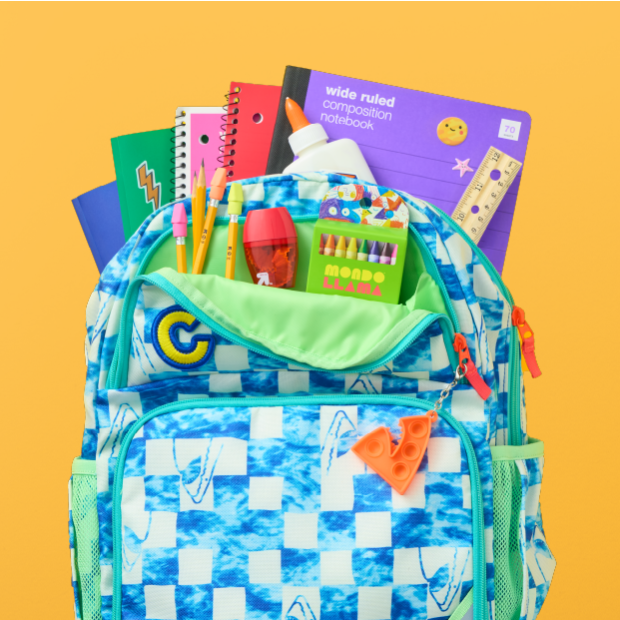 Three personalized backpacks filled with school supplies.