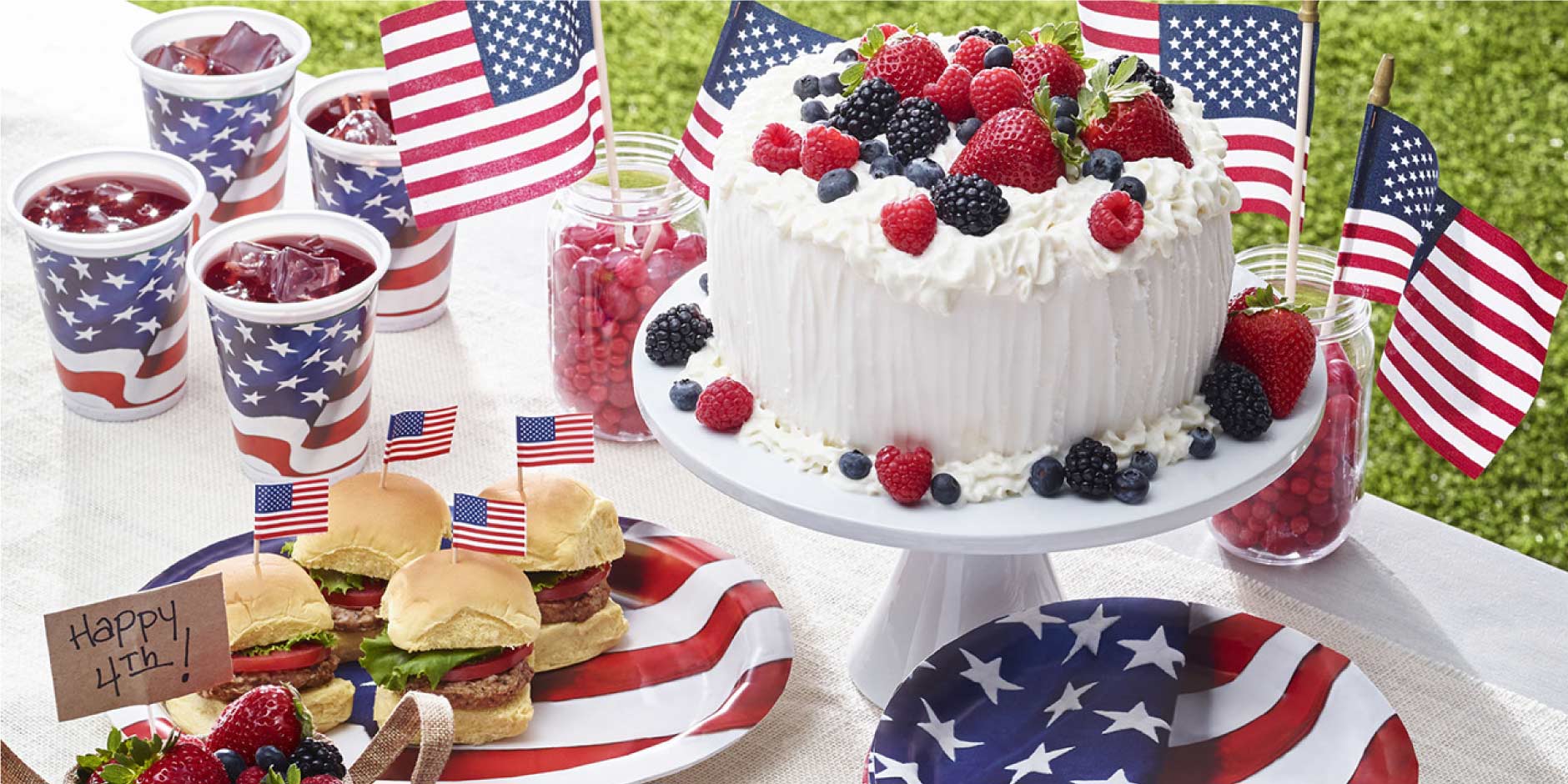 a cake with flags and food on it