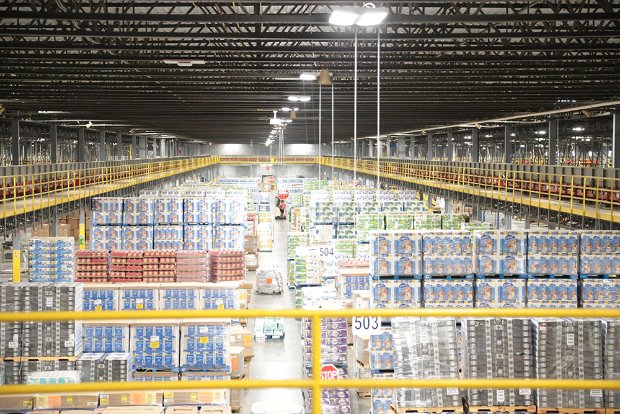 a warehouse with shelves of goods