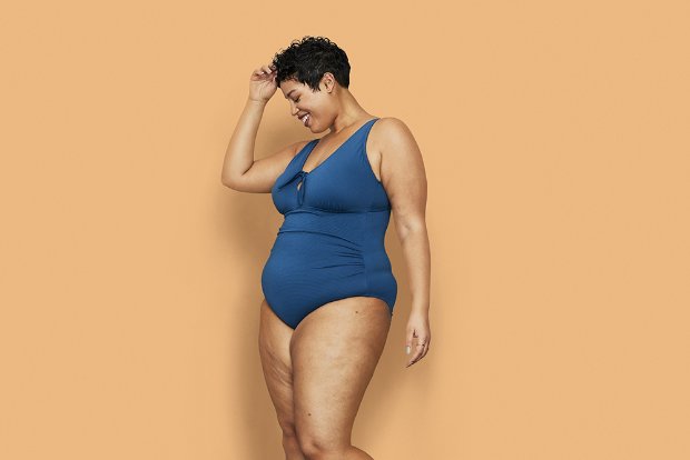 a woman in a blue swimsuit