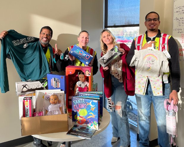 a group of people holding toys