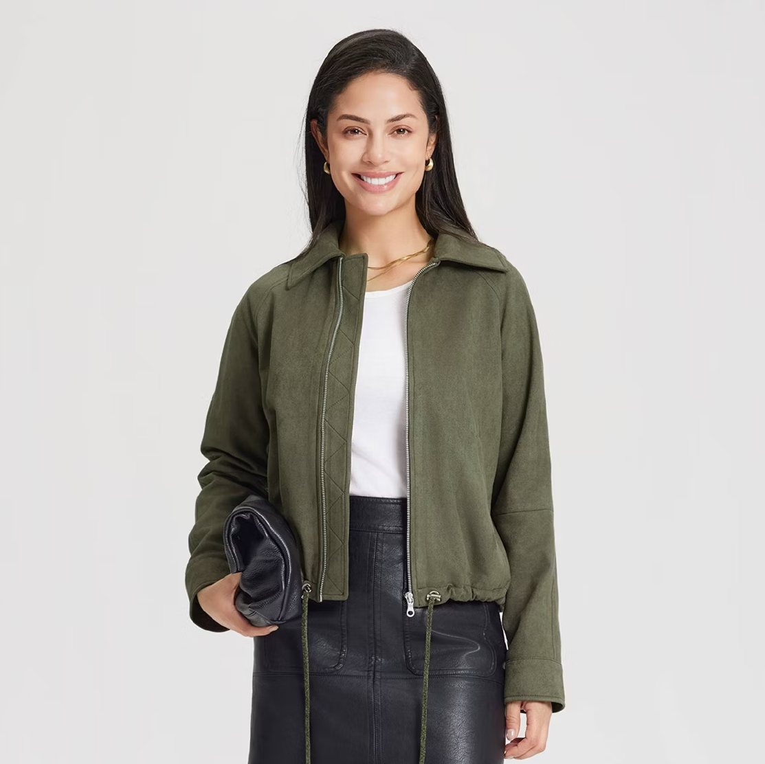 A model wearing a green suede zippered jacket