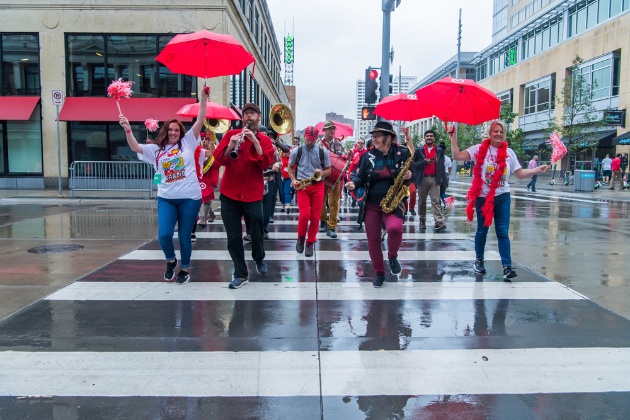 a group of people walking in the rain