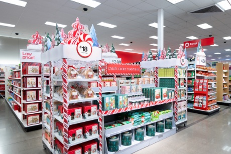 A display  of cookie kits, gingerbread houses and other baking items are displayed in front of a sign that says “create cookie traditions.”