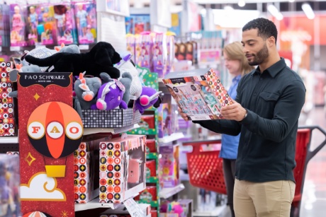 Two guests shop for toys in Target's toy aisles.