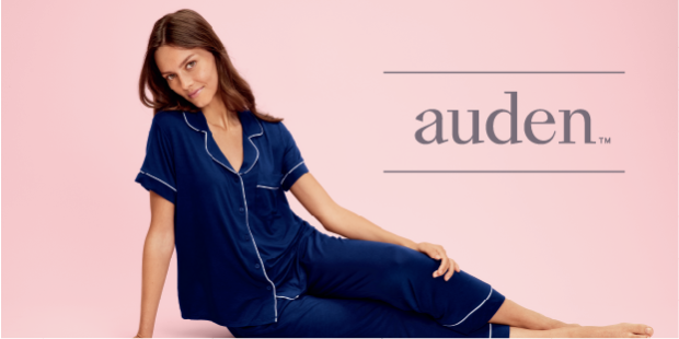 A person relaxes in comfortable navy-blue sleepwear from the Auden collection.