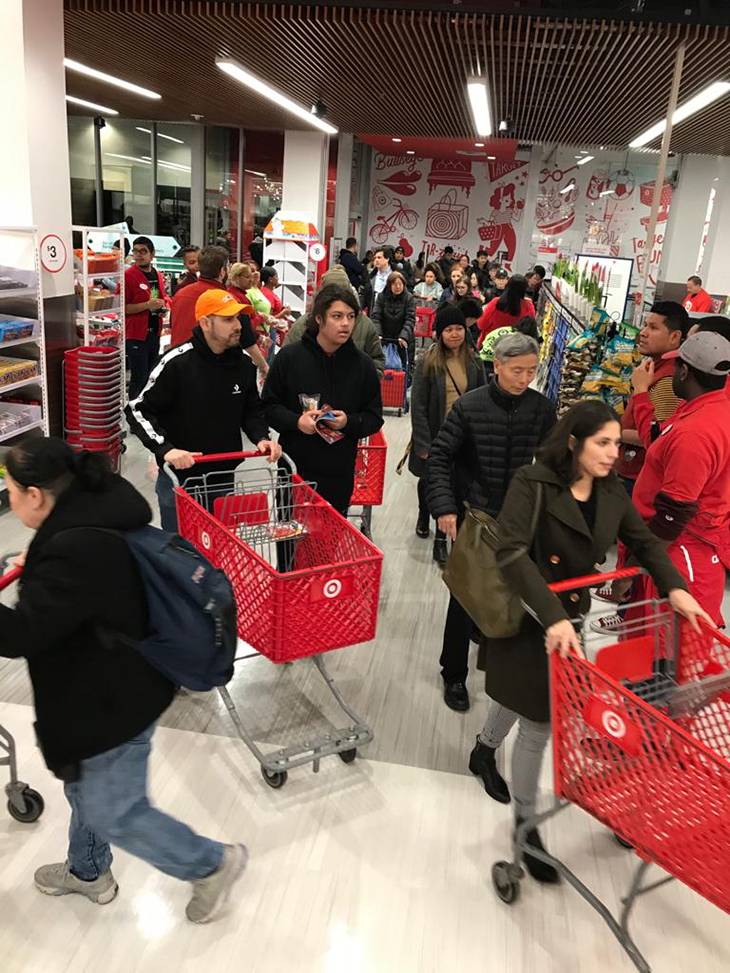 Guests with carts shopping a store