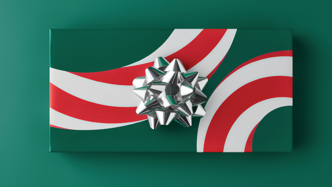 A red, white and green candy-cane-striped gift with a silver bow in the center.