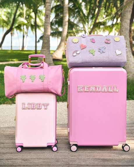 a group of pink suitcases