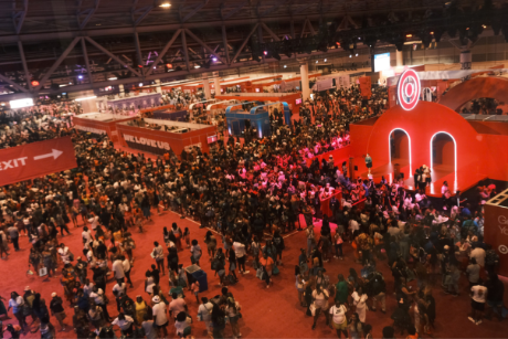 A large crowd of people is gathered around a large stage with a Bullseye logo displayed on top.