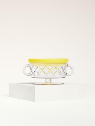 a glass bowl with a yellow liquid