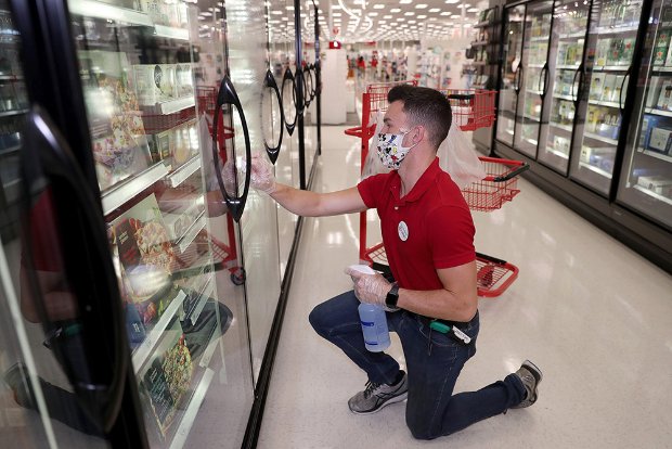 a person holding a bottle and a basket of food