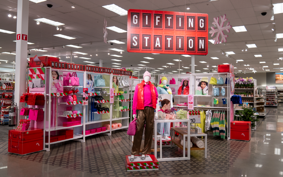 A holiday display in a Target store with a large overhead sign that reads "Gifting Station."