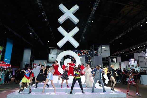 a group of people dancing on a stage