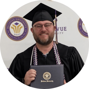 a person wearing a graduation cap and gown holding a diploma