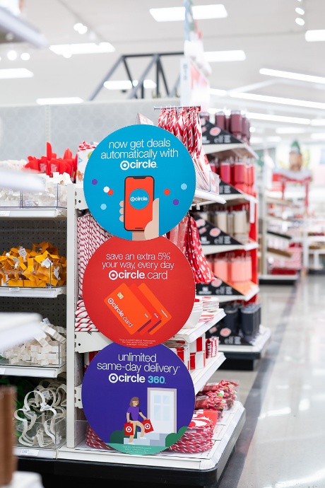 Target Circle signage is attached to an endcap full of holiday items.