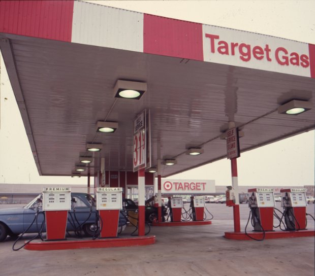 a gas station with signs