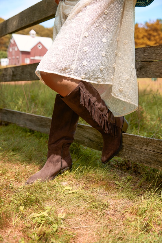 a person wearing a skirt and boots