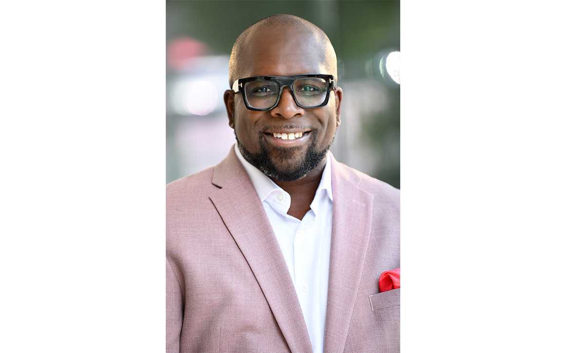 Maurice Cooper smiles in a headshot