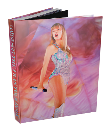 The official Taylor Swift | The Eras Tour Book propped up vertically and at a diagonal slant.