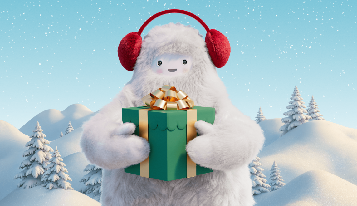 A Yeti wearing earmuffs holds a present.