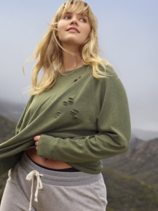 a woman in a green sweater