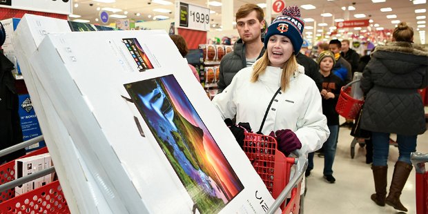 a man and woman holding a kite