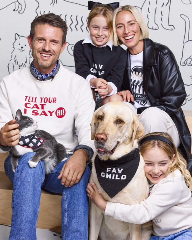 Two adult models and two child models pose with a dog and cat while wearing pieces from The Cuddle Collab collection.