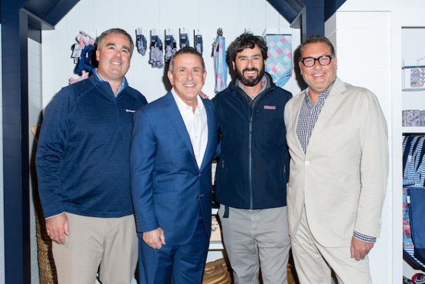 a group of men posing for a photo