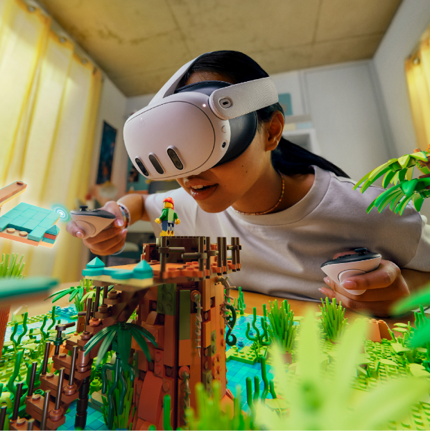 A child wears a virtual reality headset and looks over a block toy set.