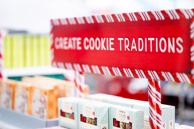 Favorite Day cookie kits and sprinkles are displayed in front of a sign that says “Create Cookie Traditions.”