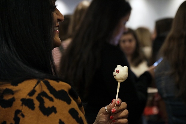 a person holding a popsicle