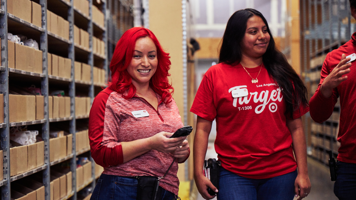 Smiling Target team members in a warehouse setting