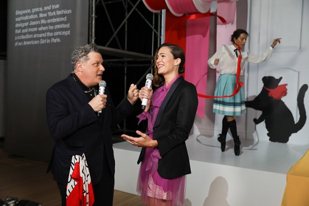 a man and woman holding microphones