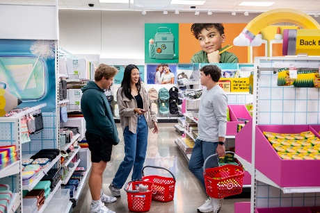 Three happy guests take a break from back-to-school shopping to socialize.