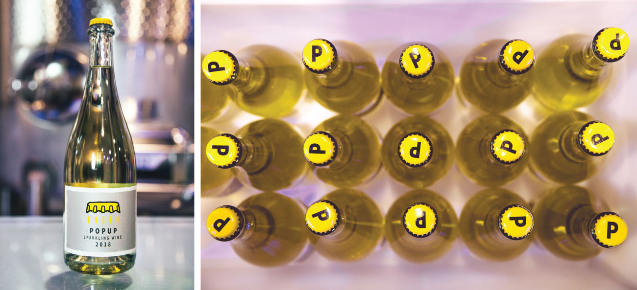A split image shows a single bottle of POPUP and a bird's-eye view of a group of bottles, showcasing the bright yellow cap emblazoned with a large
