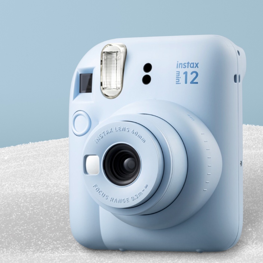 a light blue Instax mini 12 camera