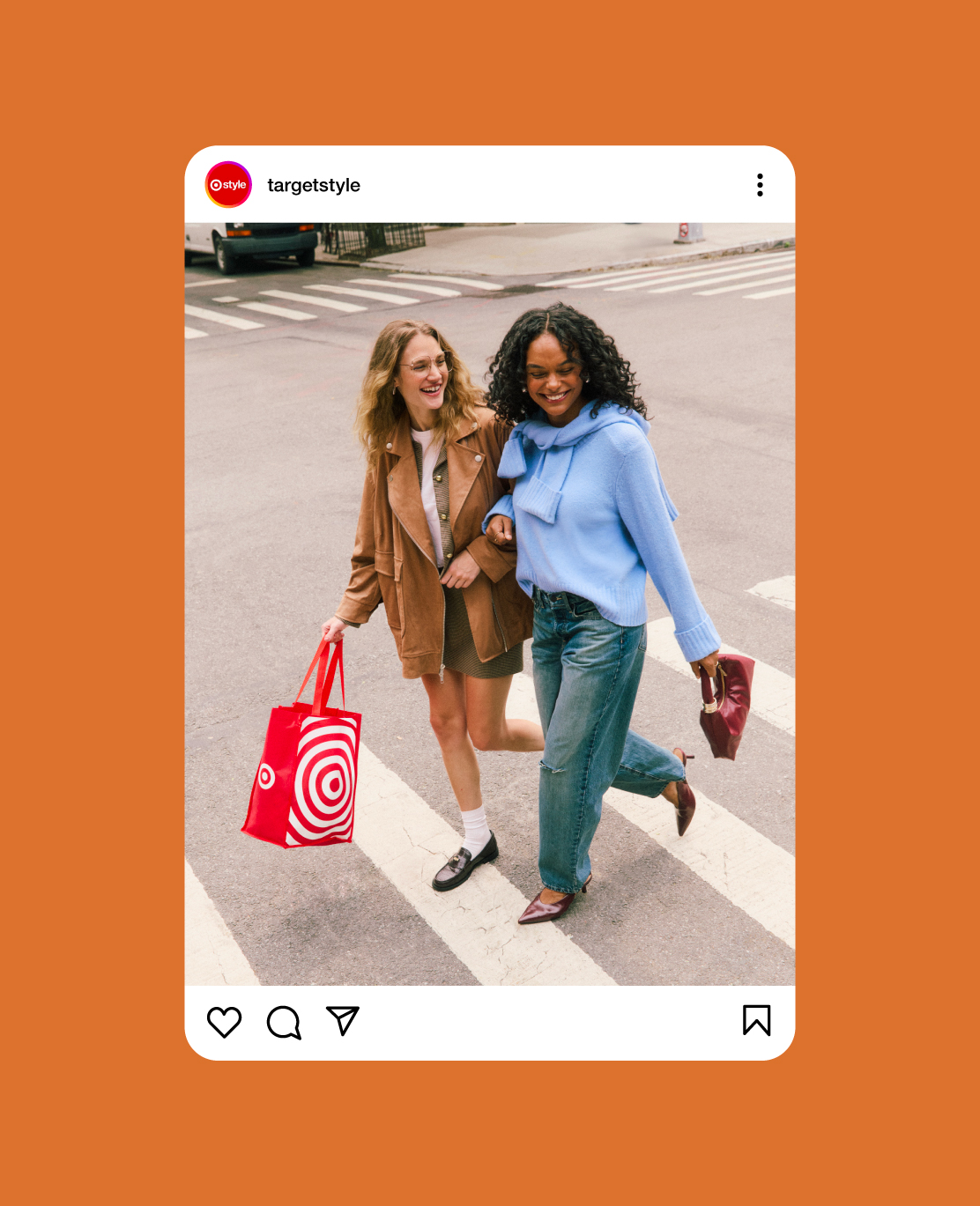 A screenshot of an Instagram post showing two models cross a street, one holding a Target shopping bag.