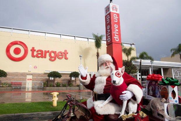 santa clause statues in front of a store