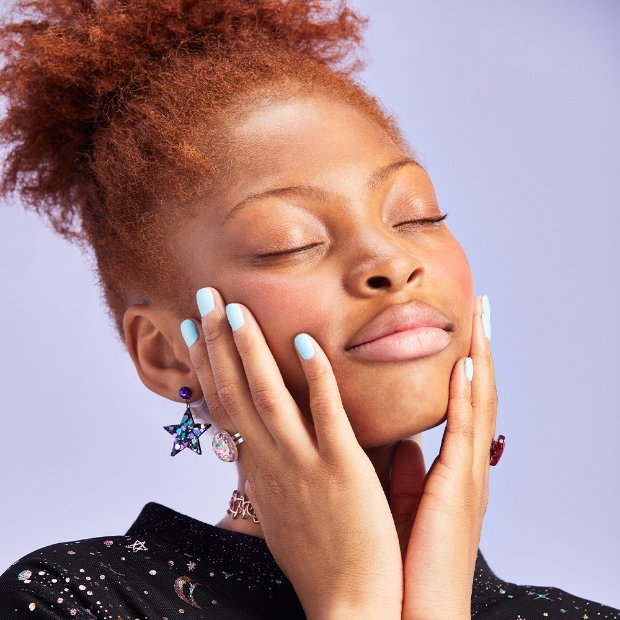 a person with the eyes closed and the hands on the face