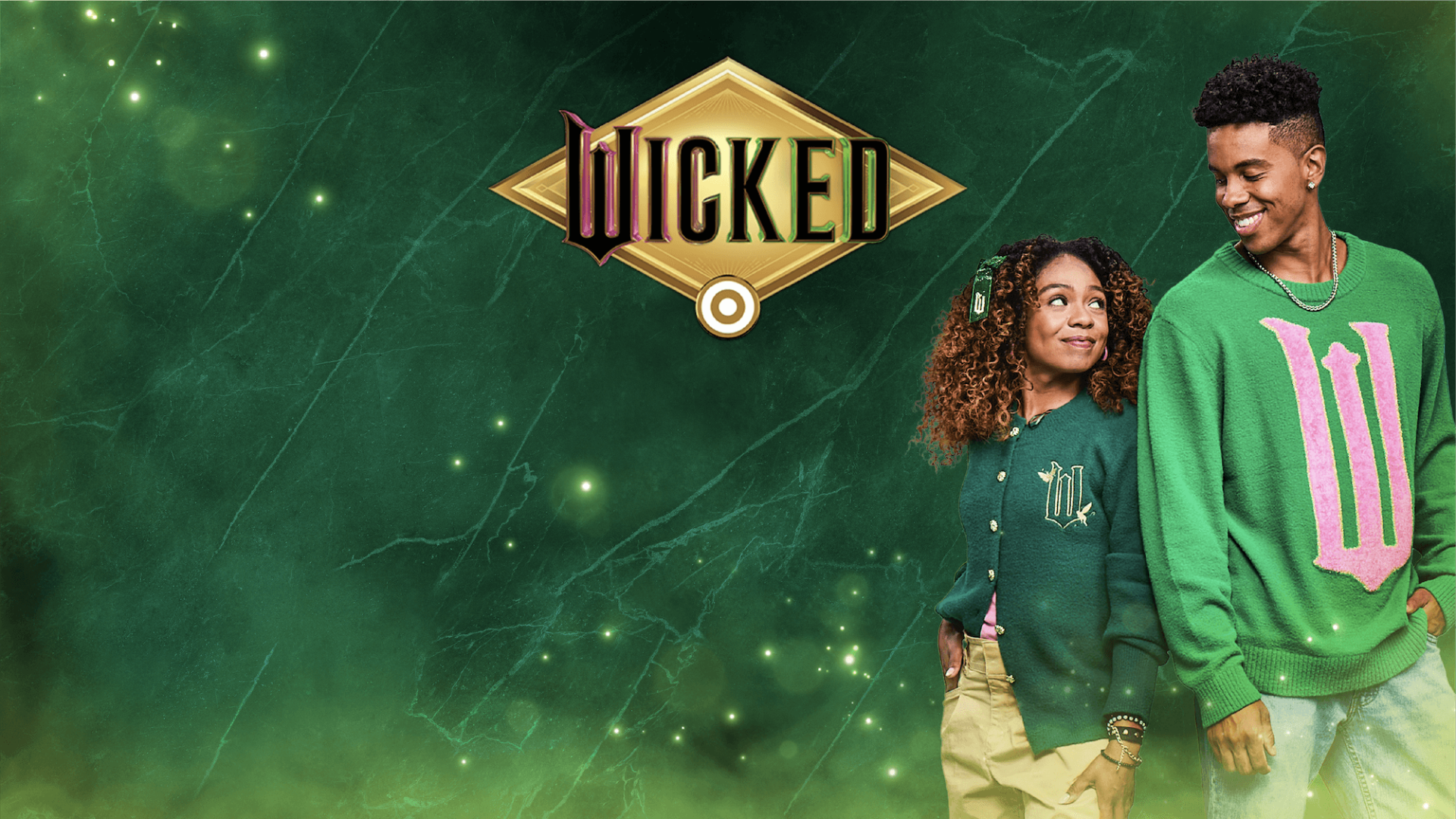 The Wicked and Target logos on a green background alongside models wearing items from the Paul Tazewell for Target collection.