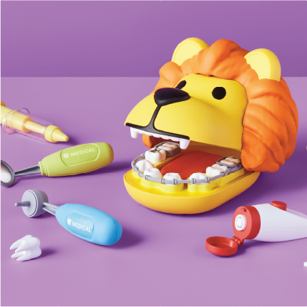 A toy lion dentist role play kit.