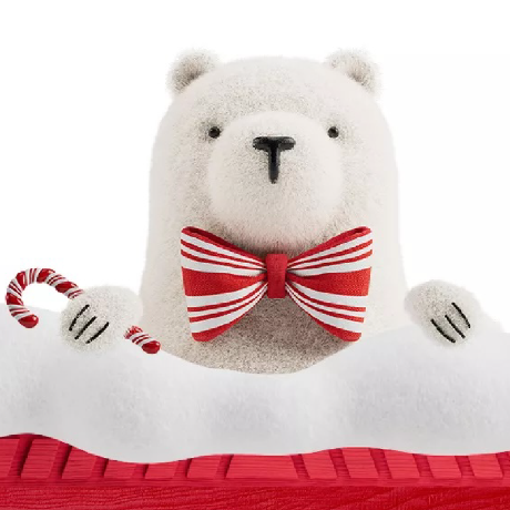 A plush polar bear wearing a bowtie.