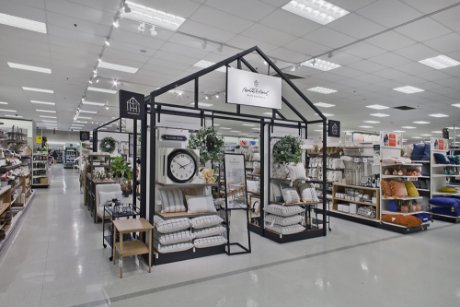 a store with a clock and shelves
