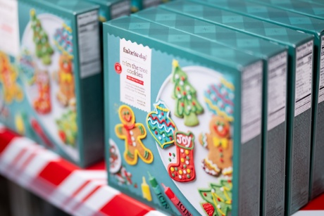 Favorite Day “trim the tree” cookie kits are lined up on shelves.