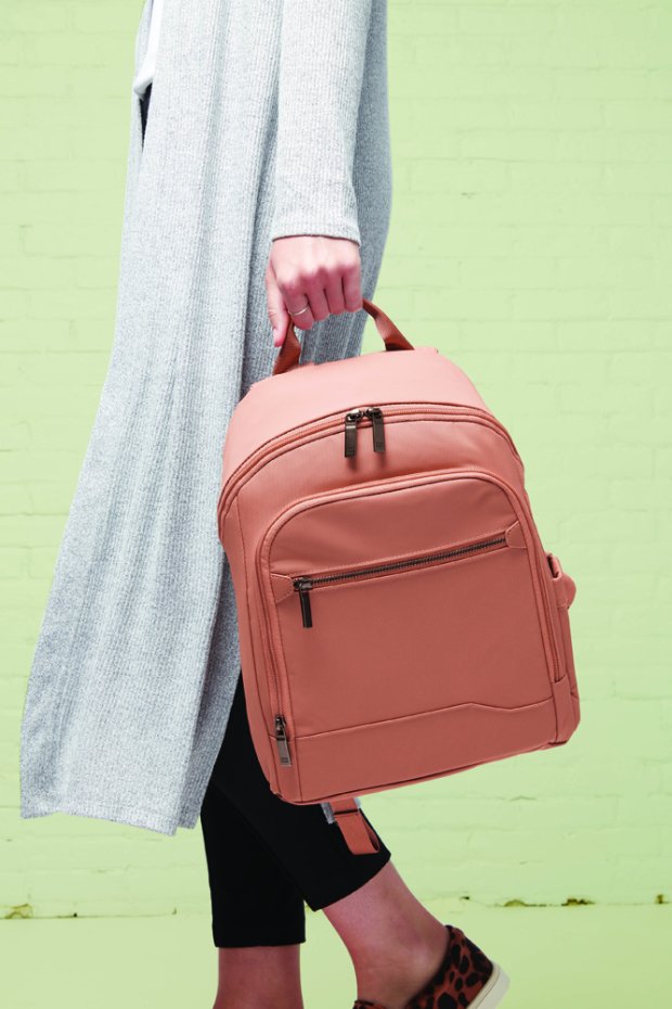 a person holding a red bag