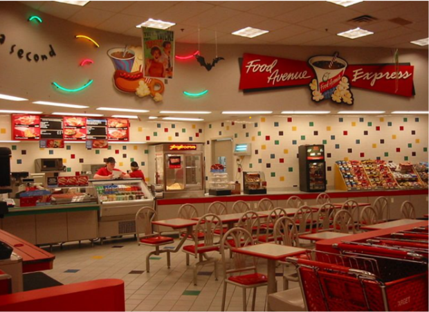 a restaurant with red chairs