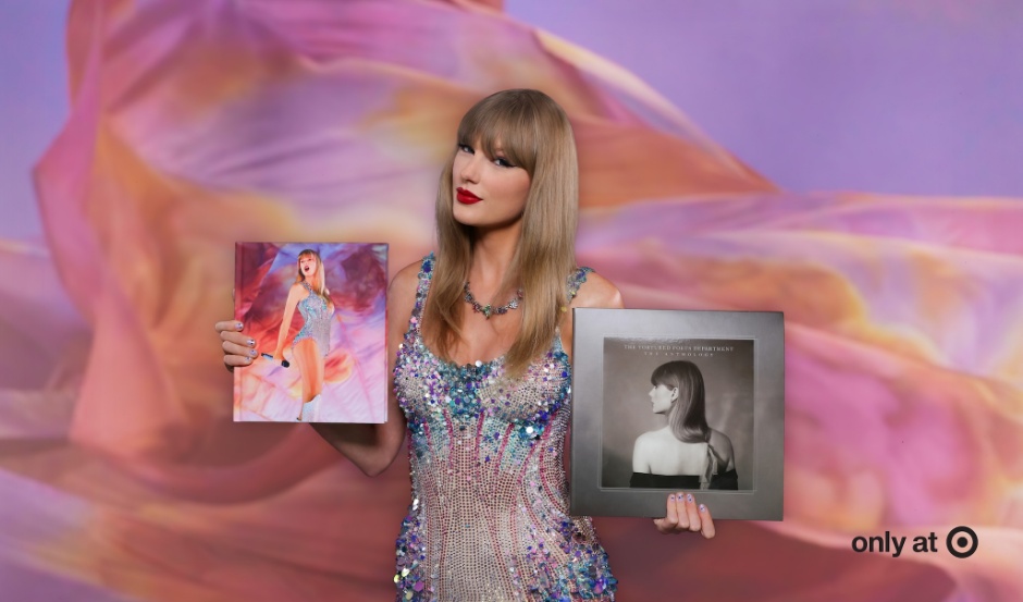 Taylor Swift holds her two new exclusive-to-Target products in each of her hands.