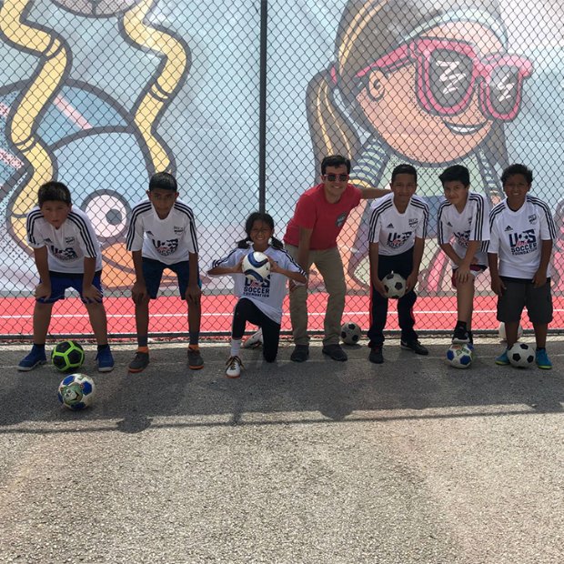 a group of boys playing football